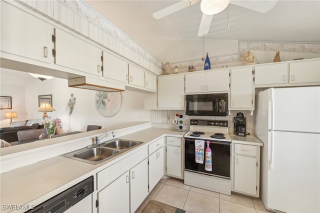 kitchen with lofted ceiling, sink, white cabinets, and white appliances