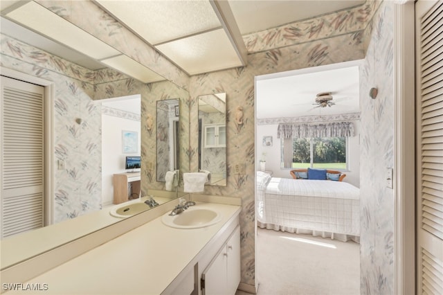 bathroom featuring ceiling fan and vanity