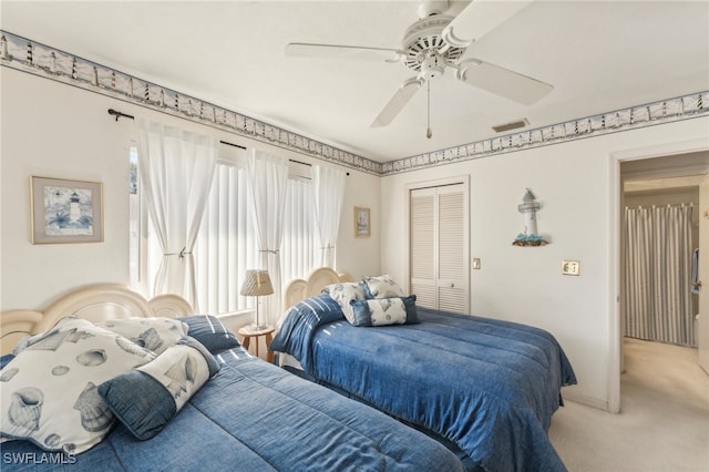 bedroom featuring carpet flooring, a closet, and ceiling fan