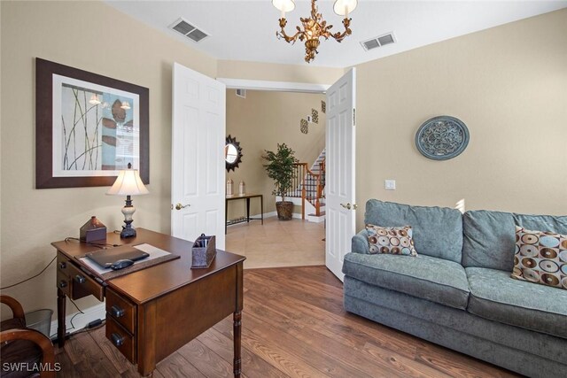 office area with a chandelier and hardwood / wood-style flooring