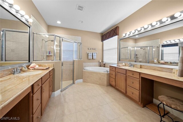 bathroom featuring tile patterned flooring, vanity, and independent shower and bath