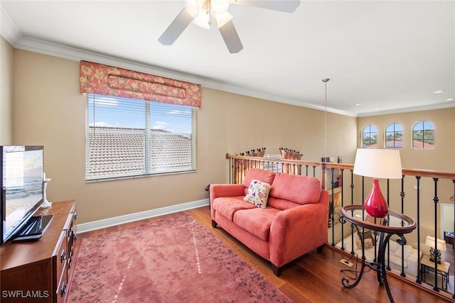 interior space with hardwood / wood-style floors, a healthy amount of sunlight, and ornamental molding