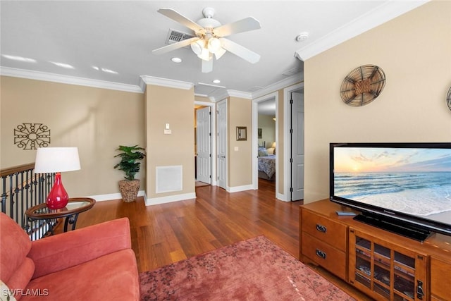 living room with dark hardwood / wood-style floors, ceiling fan, and crown molding