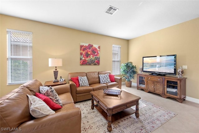 tiled living room featuring a wealth of natural light