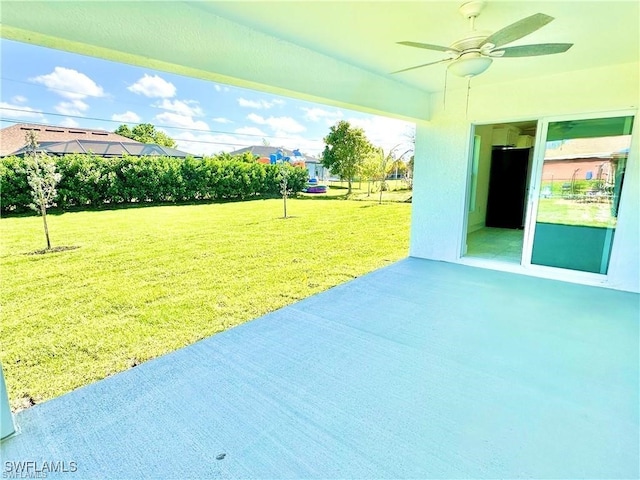 view of patio / terrace featuring ceiling fan