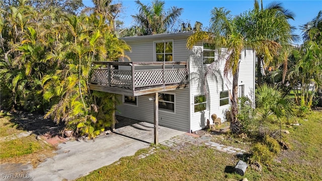 rear view of property with a deck