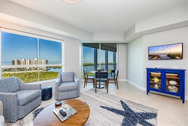 living room with tile patterned flooring and a healthy amount of sunlight