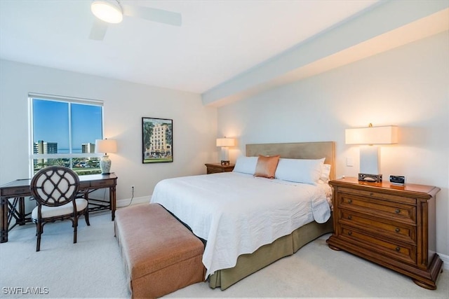 bedroom featuring ceiling fan and light colored carpet