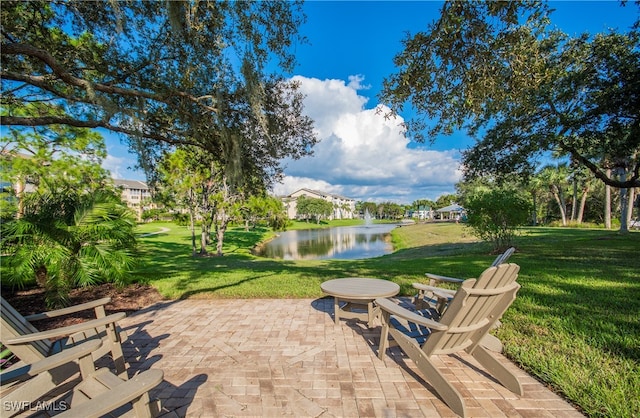 view of patio with a water view