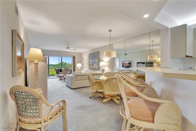 living room with ceiling fan and light carpet