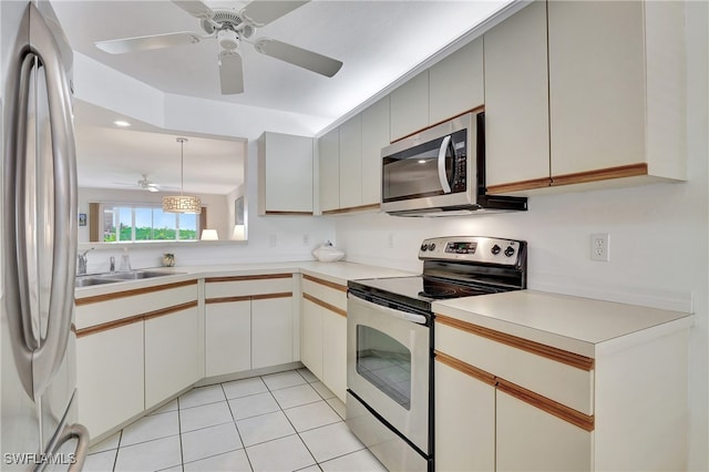 kitchen featuring sink, ceiling fan, light tile patterned flooring, white cabinetry, and stainless steel appliances