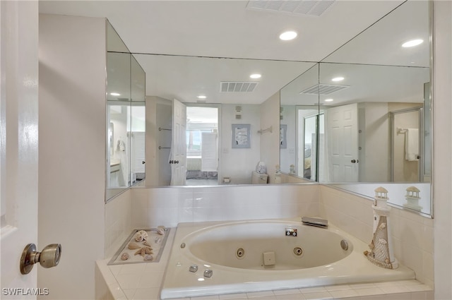 bathroom featuring tiled tub