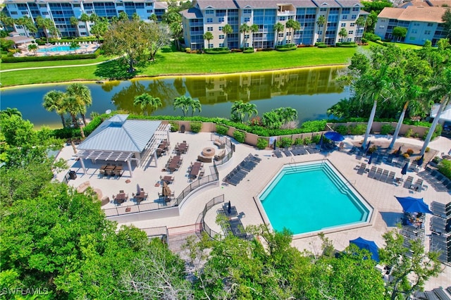 view of pool featuring a water view