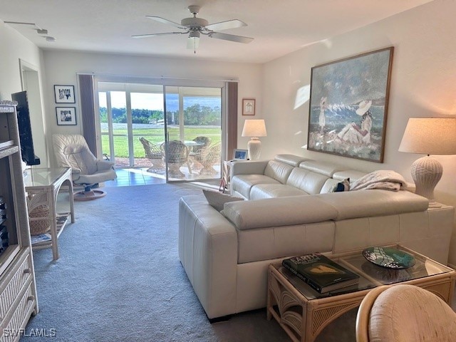 living room with carpet and ceiling fan