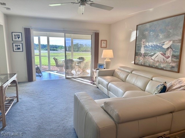 carpeted living room featuring ceiling fan