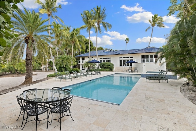 view of swimming pool with a patio area