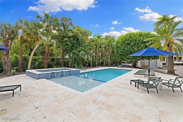 view of swimming pool with an in ground hot tub and a patio area