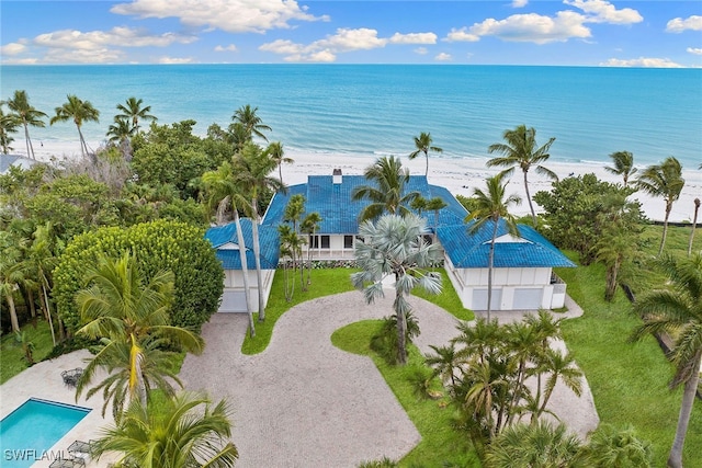 aerial view with a water view and a view of the beach