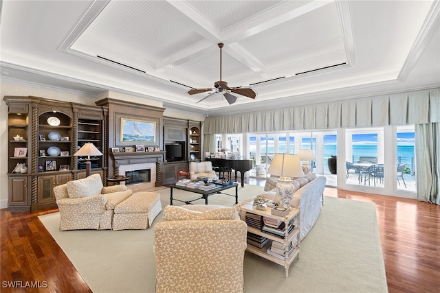 living room featuring ceiling fan, hardwood / wood-style floors, crown molding, and coffered ceiling