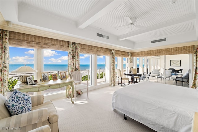 carpeted bedroom with ceiling fan, beamed ceiling, a water view, and a view of the beach