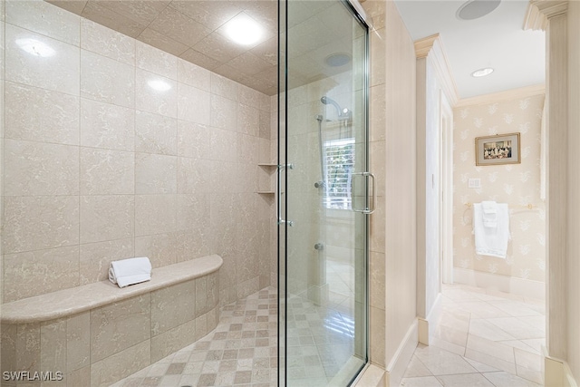 bathroom featuring tile patterned flooring, ornamental molding, and walk in shower