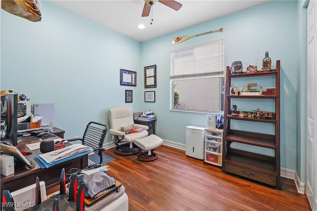 office with hardwood / wood-style floors and ceiling fan