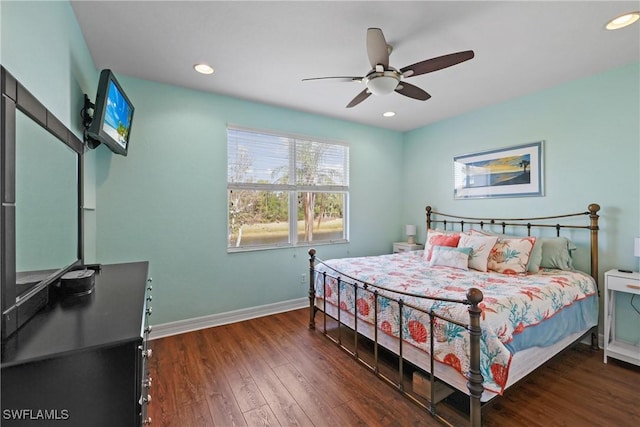 bedroom featuring ceiling fan and dark hardwood / wood-style flooring