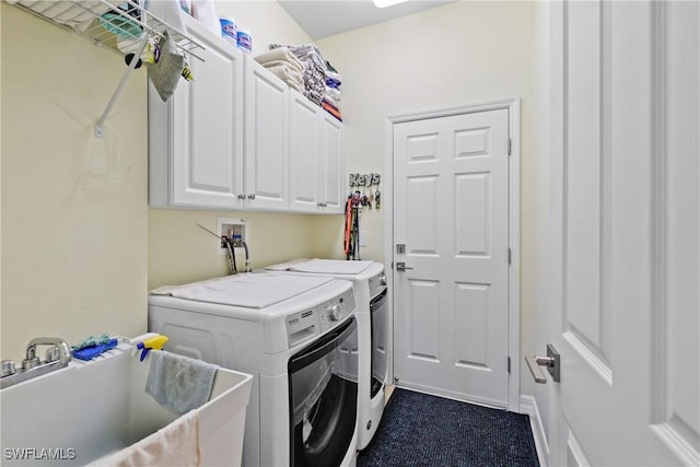 laundry room with dark colored carpet, cabinets, independent washer and dryer, and sink