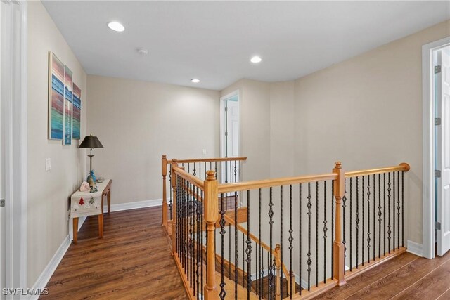 hallway featuring dark hardwood / wood-style flooring