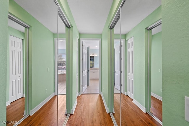 corridor featuring hardwood / wood-style flooring