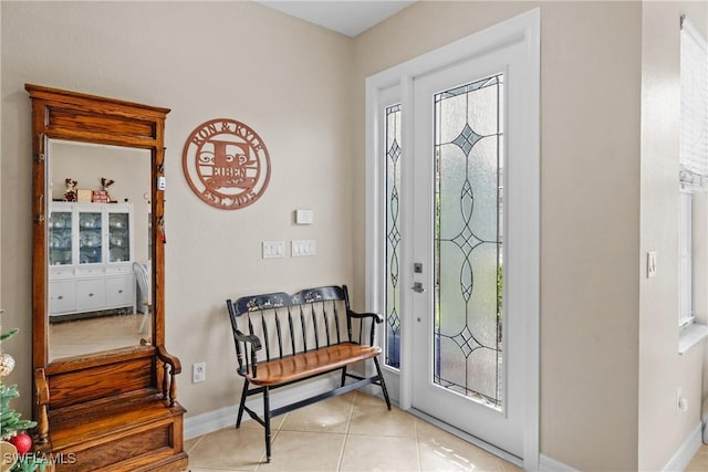 entrance foyer featuring light tile patterned floors