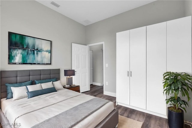 bedroom featuring dark hardwood / wood-style floors