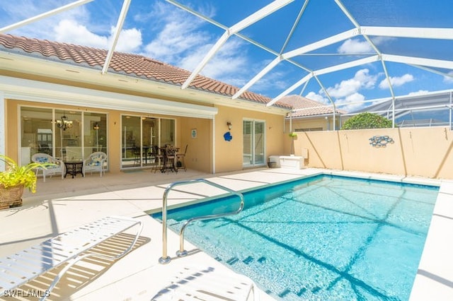 view of pool featuring a lanai and a patio