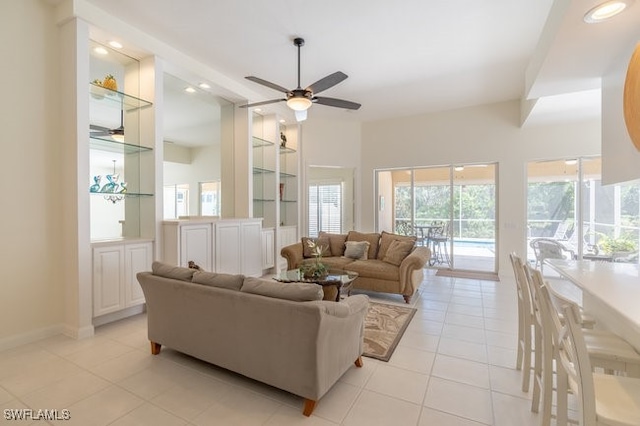 tiled living room featuring ceiling fan