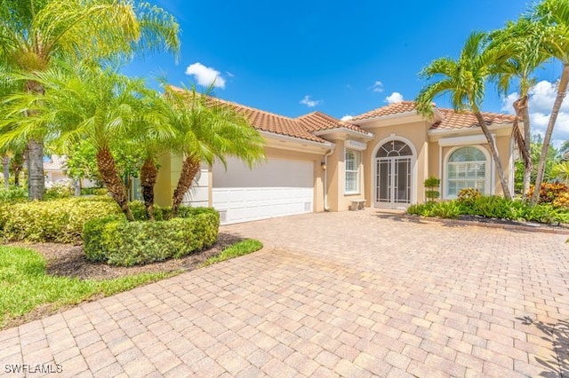 mediterranean / spanish-style house featuring a garage