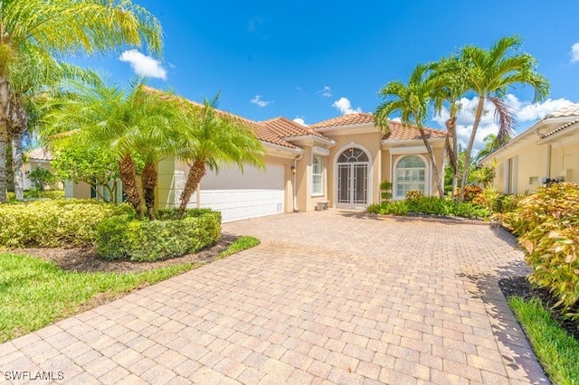 mediterranean / spanish-style house featuring a garage