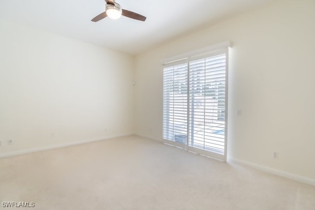 unfurnished room with carpet flooring and ceiling fan