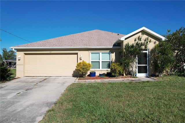 single story home with a front yard and a garage