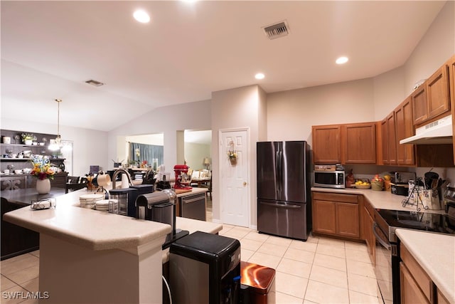 kitchen with an inviting chandelier, pendant lighting, vaulted ceiling, light tile patterned flooring, and appliances with stainless steel finishes