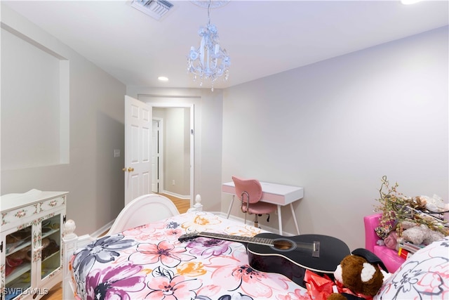 bedroom featuring a chandelier