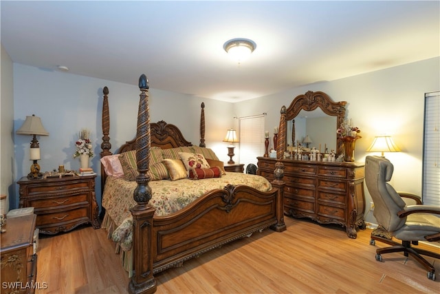 bedroom with hardwood / wood-style floors