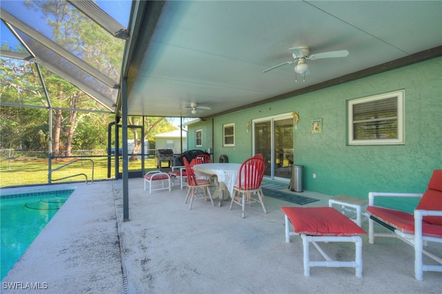 exterior space featuring a lanai, area for grilling, and ceiling fan