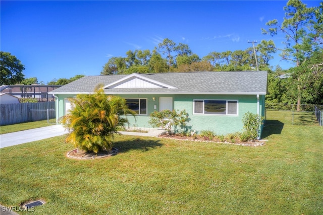 single story home with a front yard