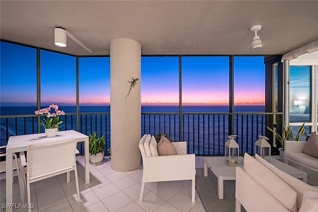 sunroom with a water view