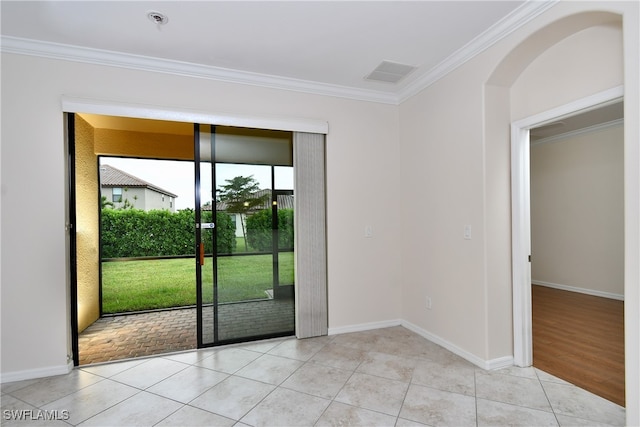 doorway to outside featuring light hardwood / wood-style flooring and ornamental molding