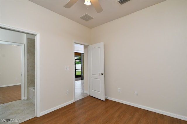 unfurnished bedroom featuring ceiling fan and light hardwood / wood-style flooring