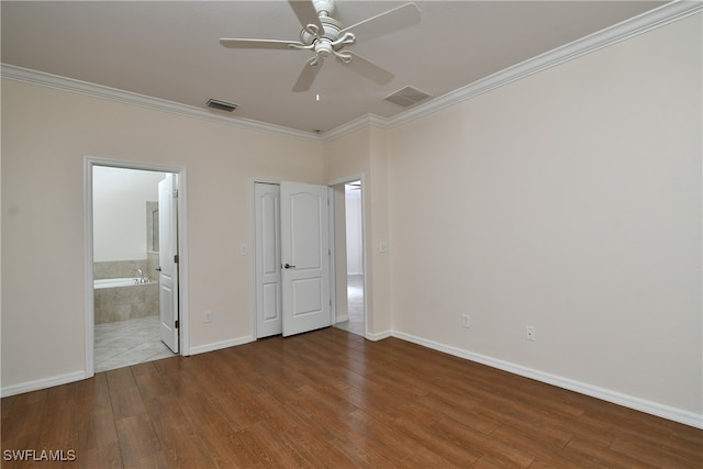 unfurnished bedroom featuring connected bathroom, ceiling fan, crown molding, and hardwood / wood-style flooring