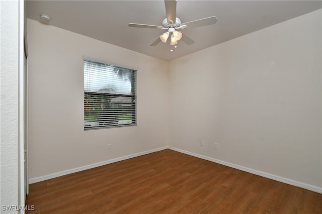 unfurnished room with hardwood / wood-style flooring and ceiling fan