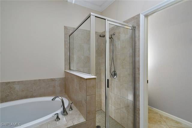 bathroom with tile patterned flooring, crown molding, and plus walk in shower