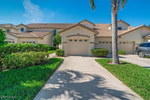 mediterranean / spanish-style house featuring a garage